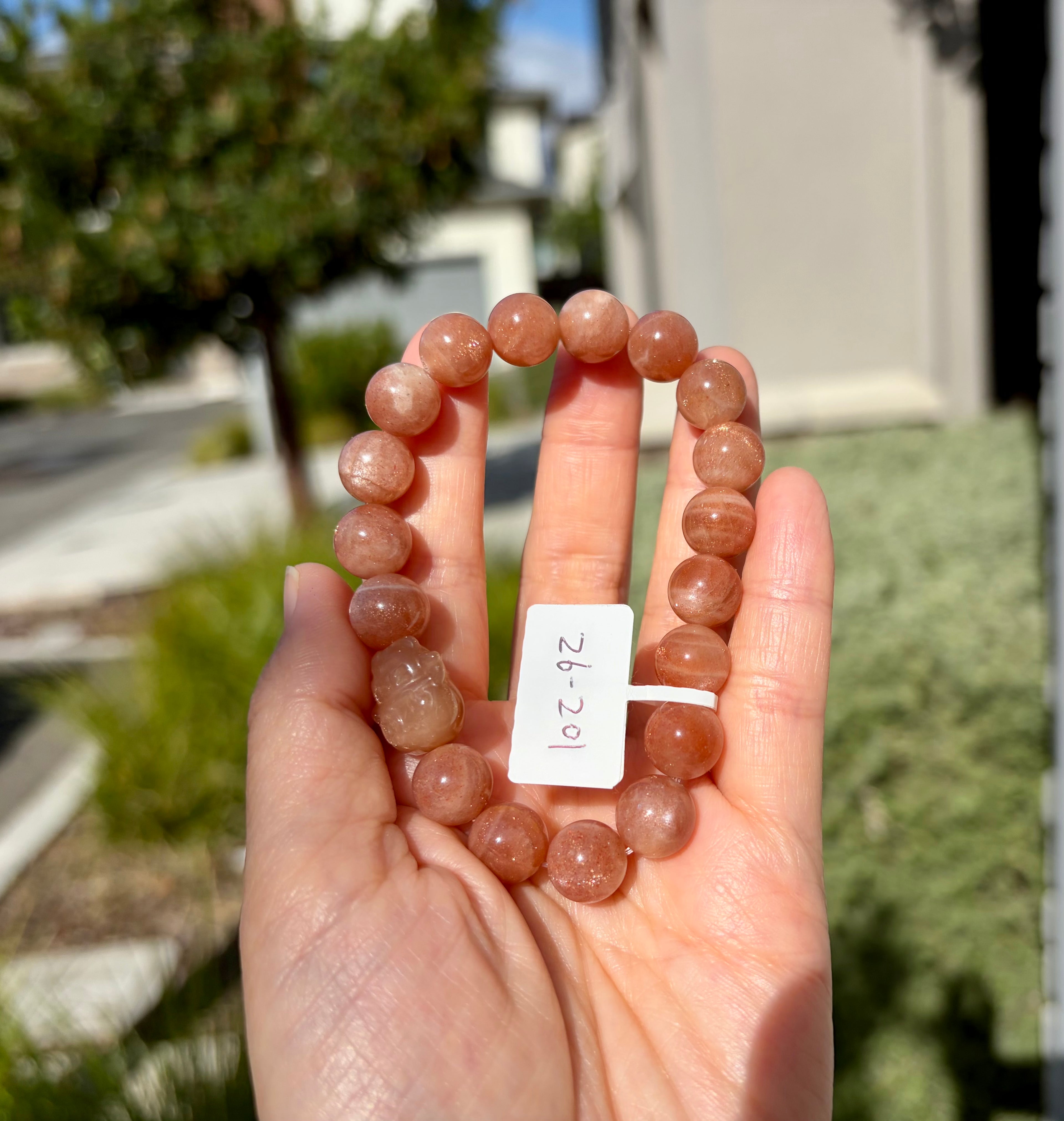 Nature Sunstone round beads bracelet featuring a carving cat, 10mm beads (26-201)